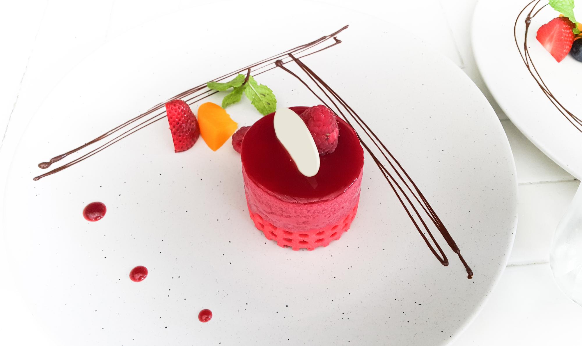 Close-up of plated dessert with molecular garnish
